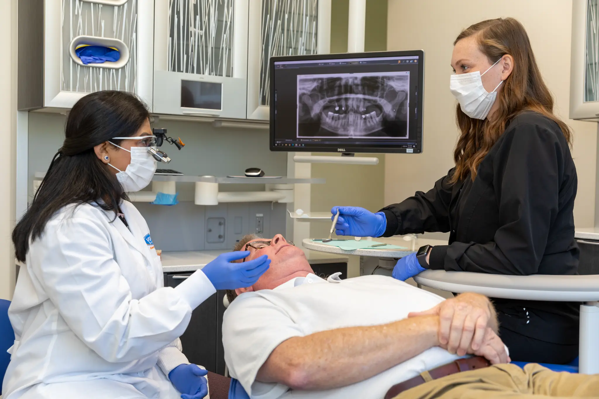 VSP Dental clinicians providing care to a patient during bone-grafting treatment planning